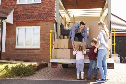 Business relocation setup with labels, furniture, and packing materials