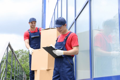 Office furniture and equipment being prepared for a local commercial move