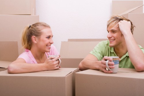 Removal team planning a home move in Swiss Cottage with boxes and furniture