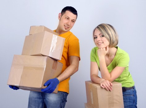 Professional movers loading items for a local move in Swiss Cottage