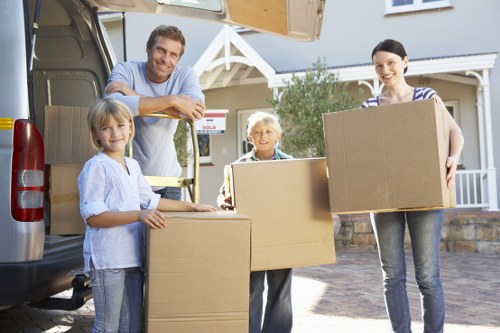 Packed boxes and furniture ready for local moving service