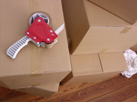 Careful loading of furniture into a moving van in Swiss Cottage