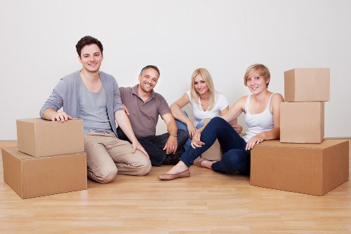 Unpacking boxes in a Swiss Cottage flat after relocation