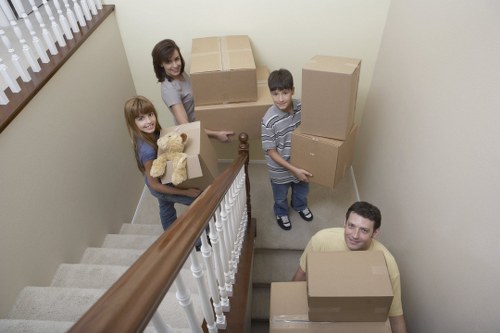 Professional movers handling office furniture near Swiss Cottage